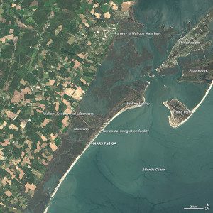 : Landsat 8 captured this image of Wallops Island and the surrounding area on May 3, 2014. A variety of launch-related infrastructure is visible along the coast, including rocket storage and assembly buildings, launch pads and protective sea walls. A causeway and bridge connect the island with the Delmarva Peninsula.