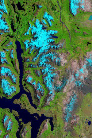 This image taken Jan. 14, 2015, by the Operational Land Imager on Landsat 8 shows the glaciers of Sierra de Sangra, an icy stratovolcano spanning the border of Chile and Argentina. Snow and ice are blue in the false-color image, which uses different wavelengths to better differentiate areas of ice, rock and vegetation. (Credit: NASA/Landsat 8)