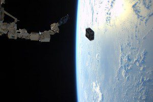 Tim Peake of the European Space Agency (ESA) captured this photo on Jan. 29, 2016, from the International Space Station, as the robotic arm in Japan’s Kibo laboratory successfully deployed two combined satellites from Texas universities. (Credit: ESA/NASA)