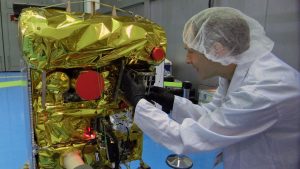 The BEESAT-4 picosatellite was installed in the BIROS fire-detection satellite by a staff member of TU Berlin before BIROS was launched into space on June 22, 2016. (Credit: DLR)