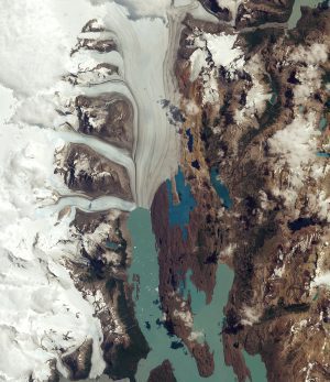 In this Sentinel-2A image of the Upsala Glacier, darker lines following the flow of the glacier are moraines: accumulations of rock, soil and other debris—including glacial milk—deposited by the glacier. (Credit: Contains modified Copernicus Sentinel data (2016), processed by ESA)